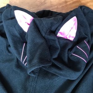 Black cat suit with pink ears and whiskers